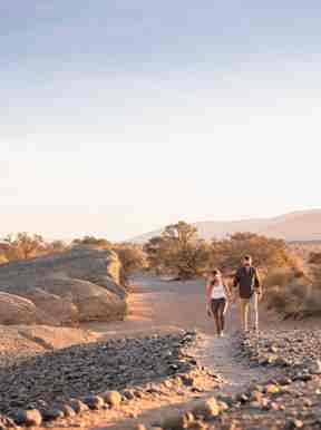 Two guests walking on the path at Kulala Desert Lodge in Namibia