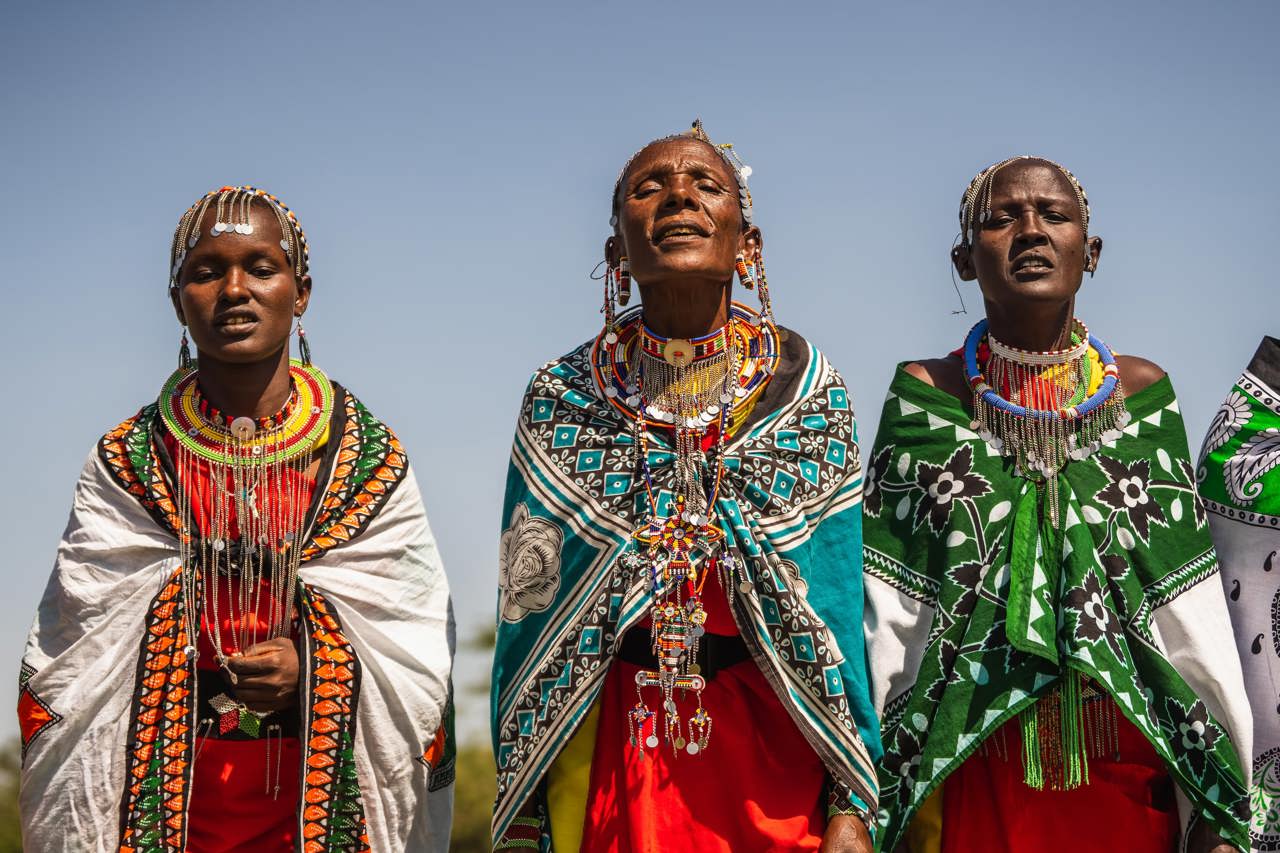 Maasai warriors displaying their colourful clothing and cultural song and dance near Wilderness Mara