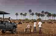 Guests watching wildlife and enjoying sundowners at Wilderness Qorokwe