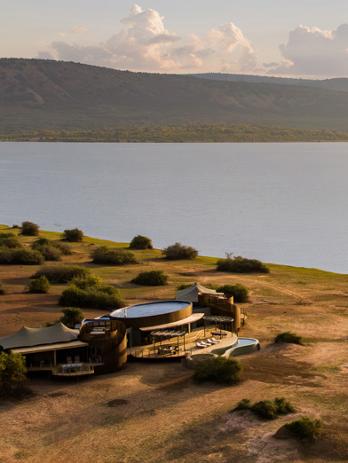An aerial view of Wilderness Magashi Peninsula on the banks of the lake in Akagera Rwanda