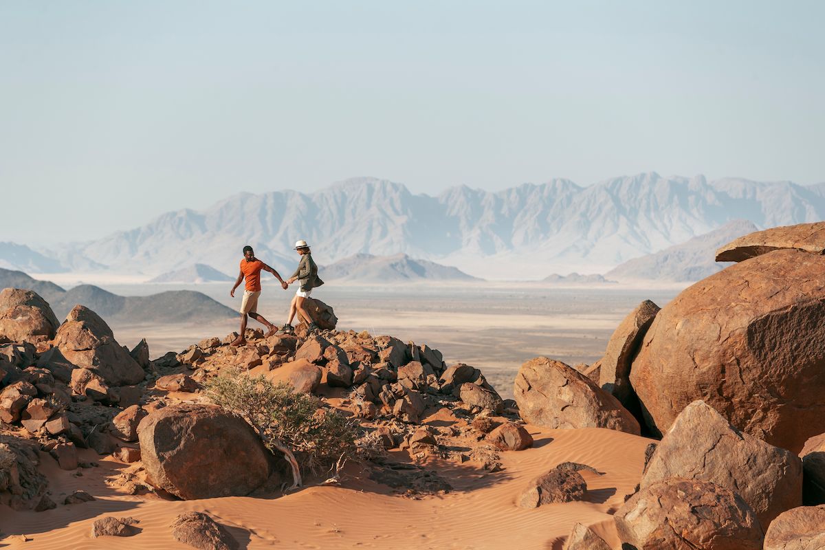 Guests from Wilderness Little Kulala hiking in the Namib desert
