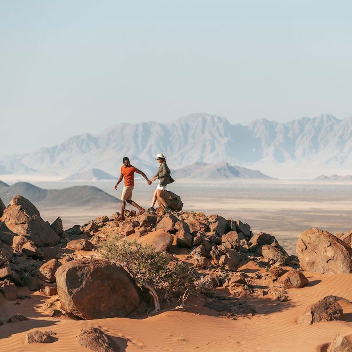 Guests from Wilderness Little Kulala hiking in the Namib desert