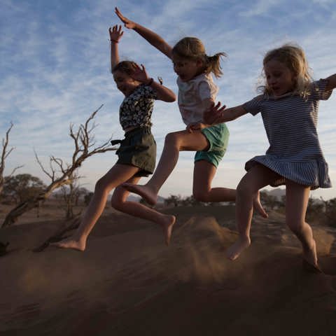 Wilderness Namibia Family Offering Children On Safari