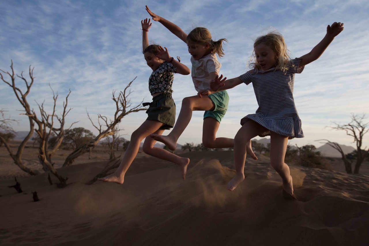 Wilderness Namibia Family Offering Children On Safari