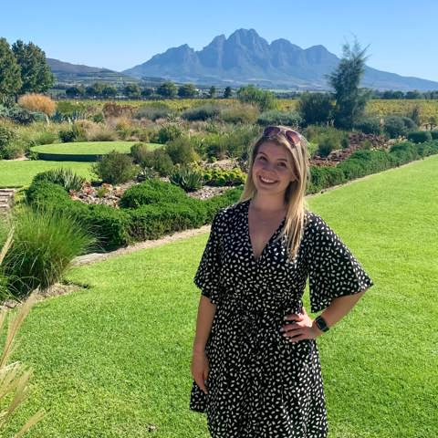 Kirsty posing against Franschoek landscape