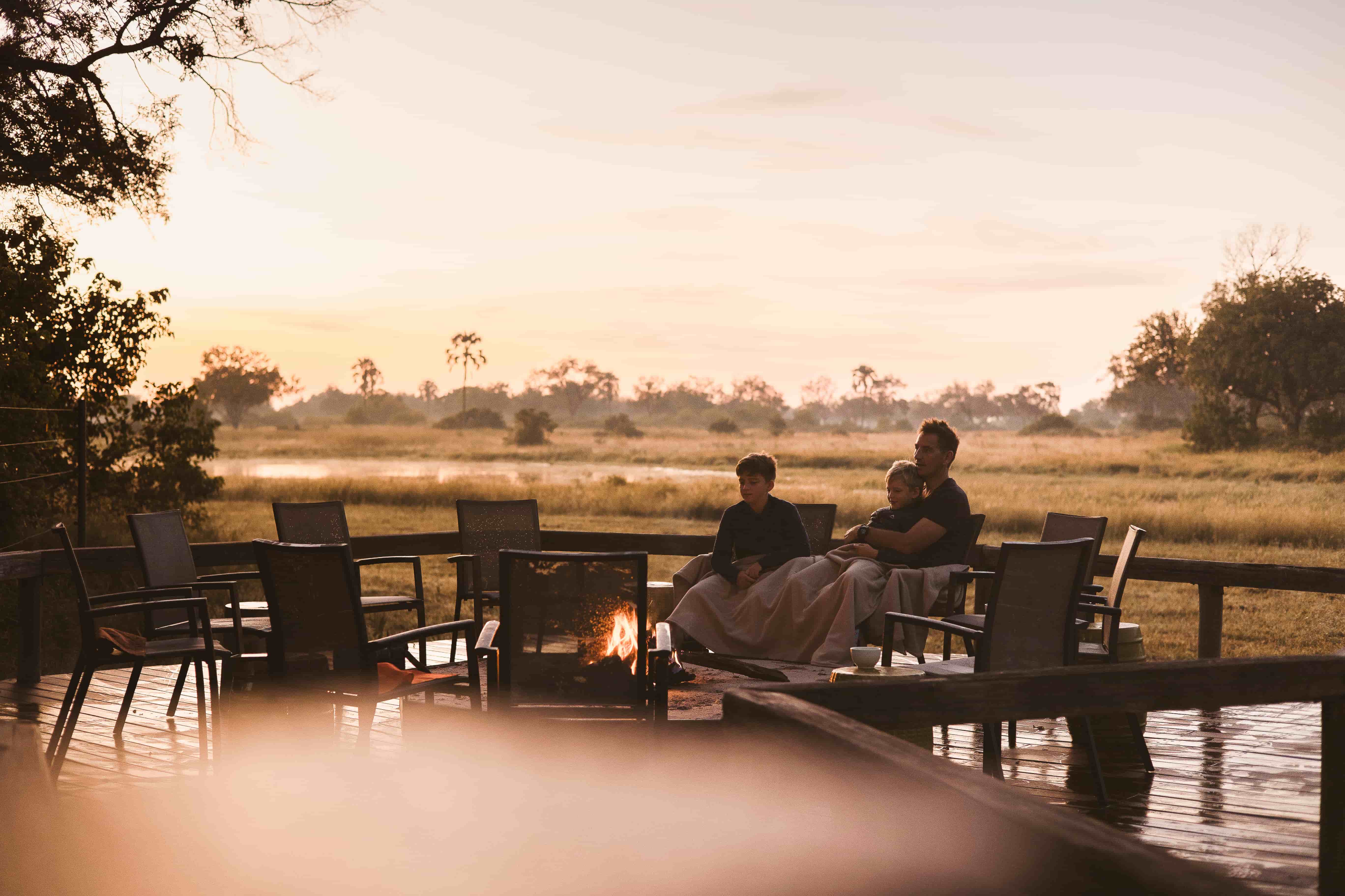 Wilderness Chitabe Lediba family sitting around a fire pit