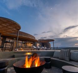 A roaring camp fire on the private deck of the Villa at Magashi Peninsula