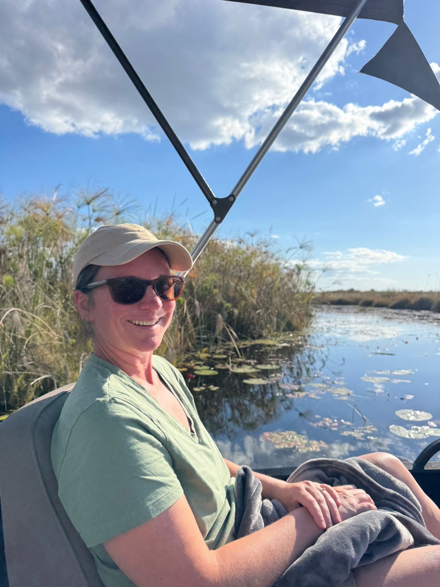 Laura Paterson on a boat in the Linyanti