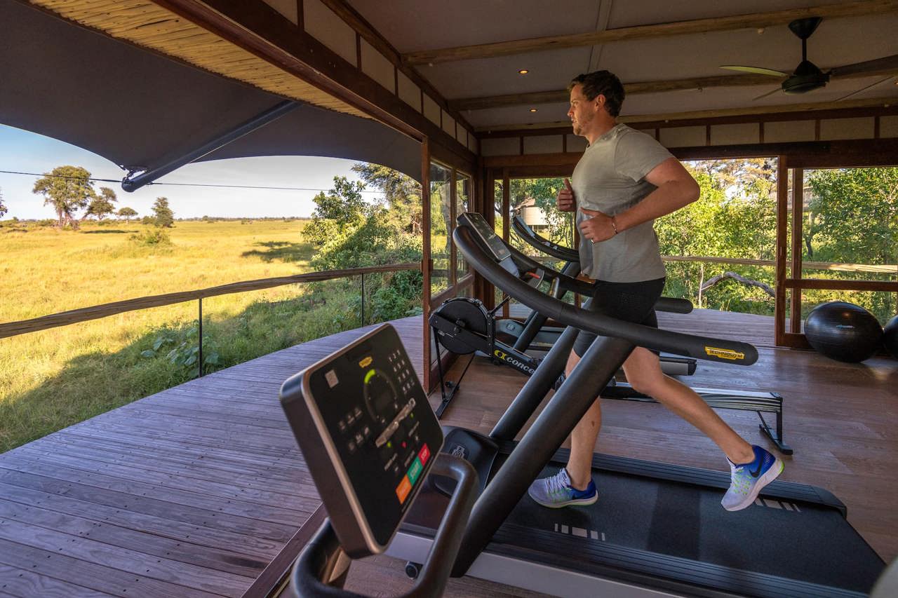 Man running on treadmil in the gym at Mombo