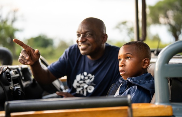 Guide showing a local child the wonder of the Wilderness CITW