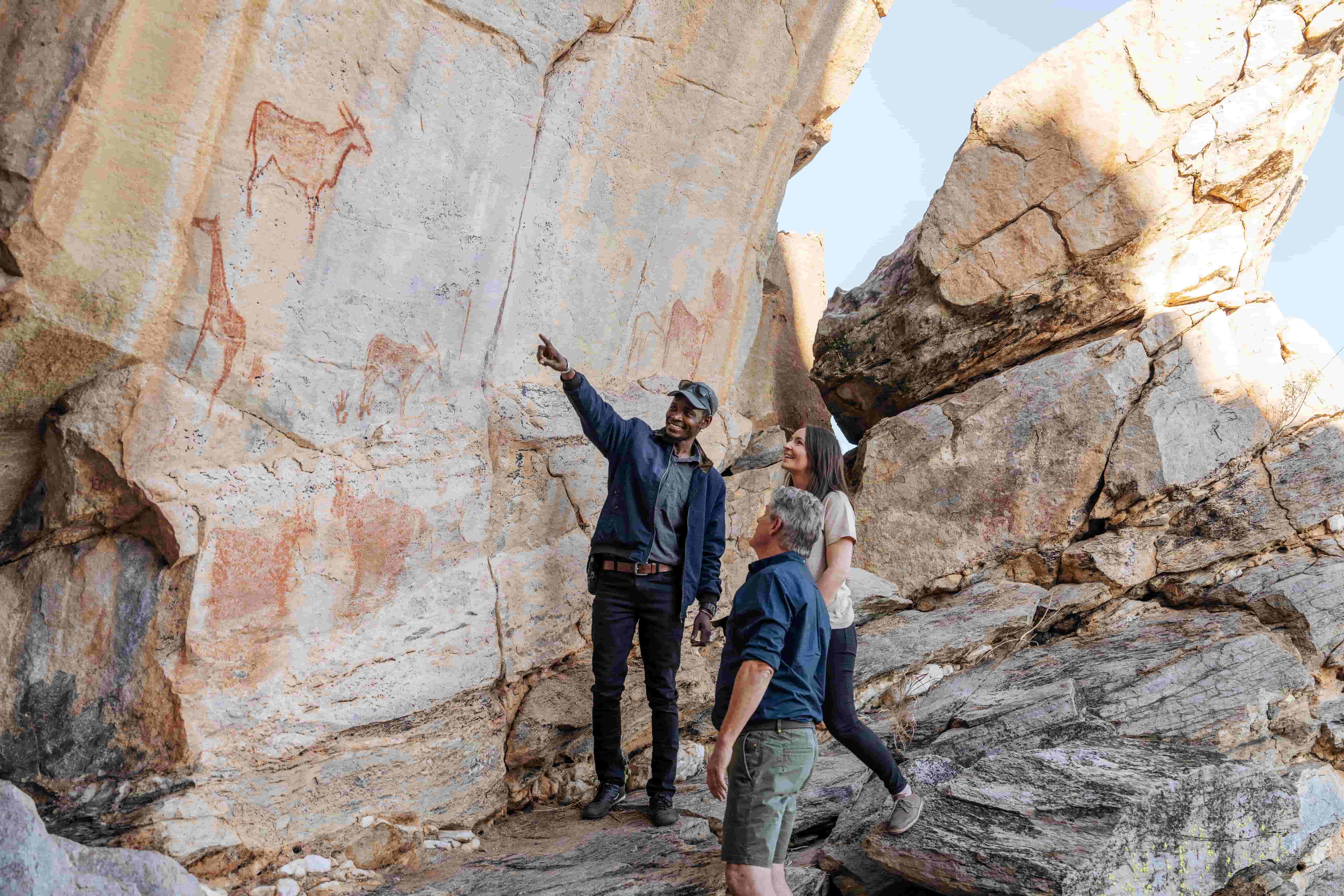 Tourists viewing rock art at Tsodilo Hills Botswana