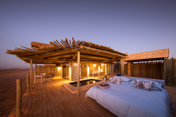 Little Kulala guest suite  with Star Bed looking up at the night sky above the Namib Desert