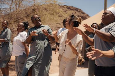 Hoanib Skeleton Coast Camp Staff Dancing with guest 