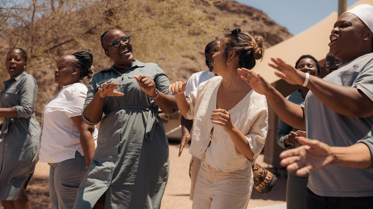 Hoanib Skeleton Coast Camp Staff Dancing with guest 