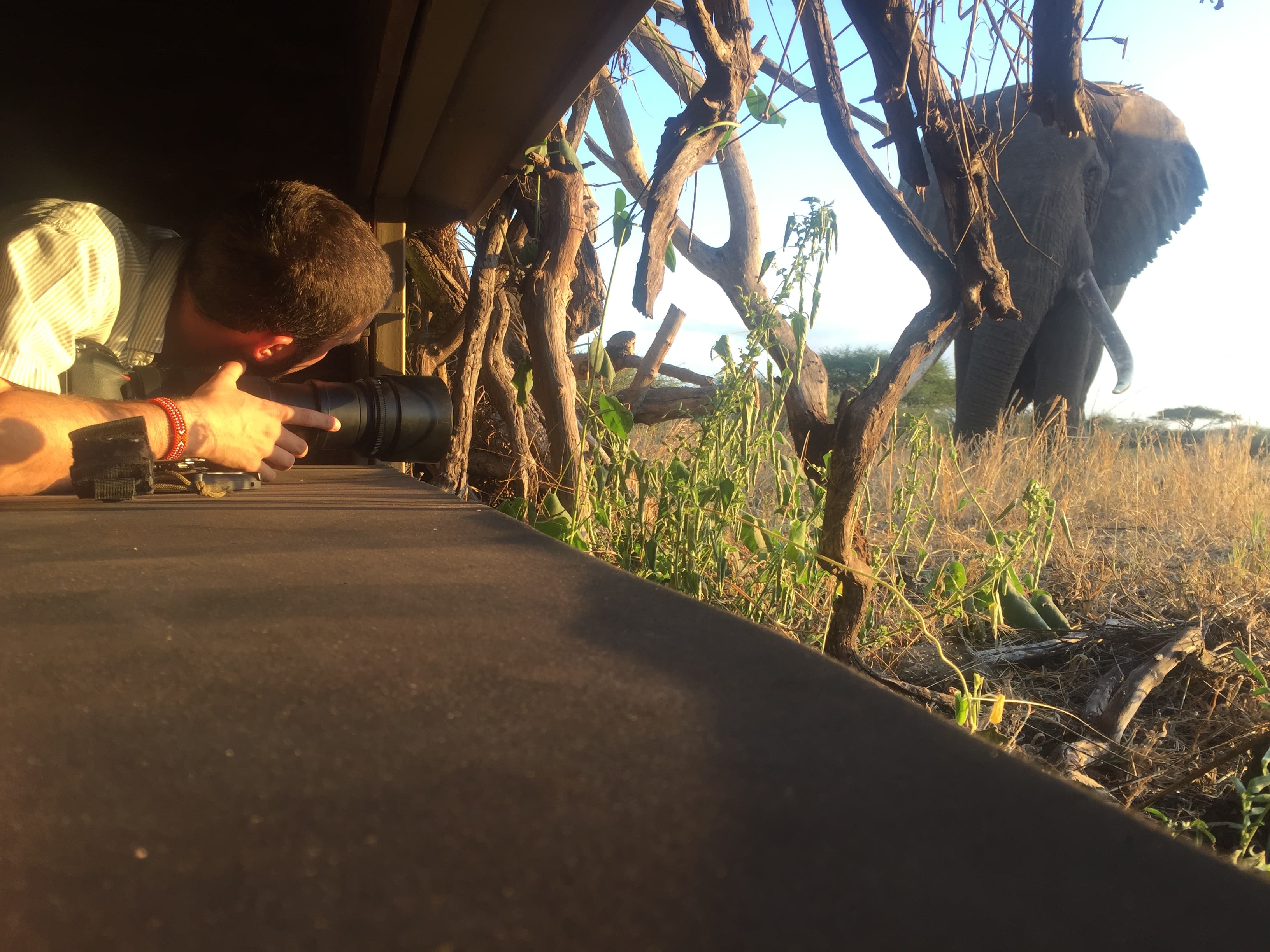Edward photographing elephants from within the hide in Kenya