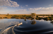 Boating in the channels of the Okavango Delta at Wilderness Little Vumbura