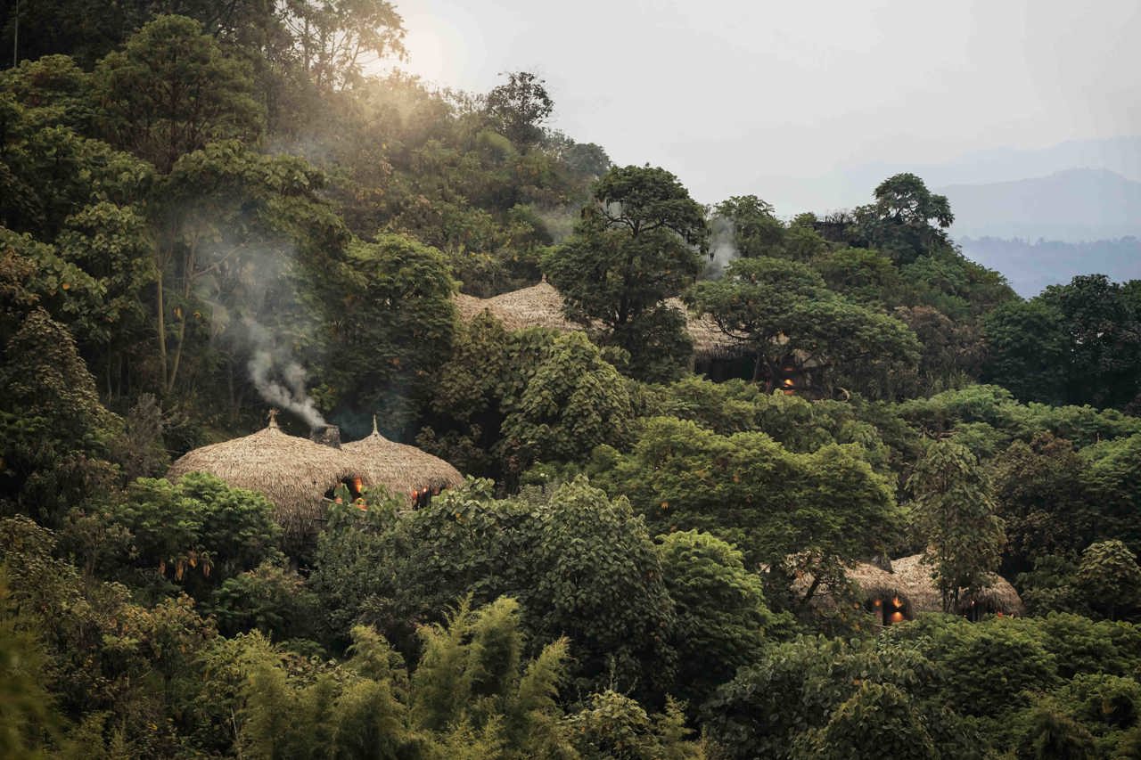 Luxury safari camp architecture blending into wilderness landscape Bisate Lodge Rwanda