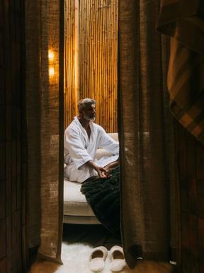 Guest seen relaxing at The Sanctuary at Wilderness Bisate in Rwanda