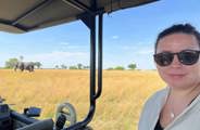 Woman on a game drive vehicle