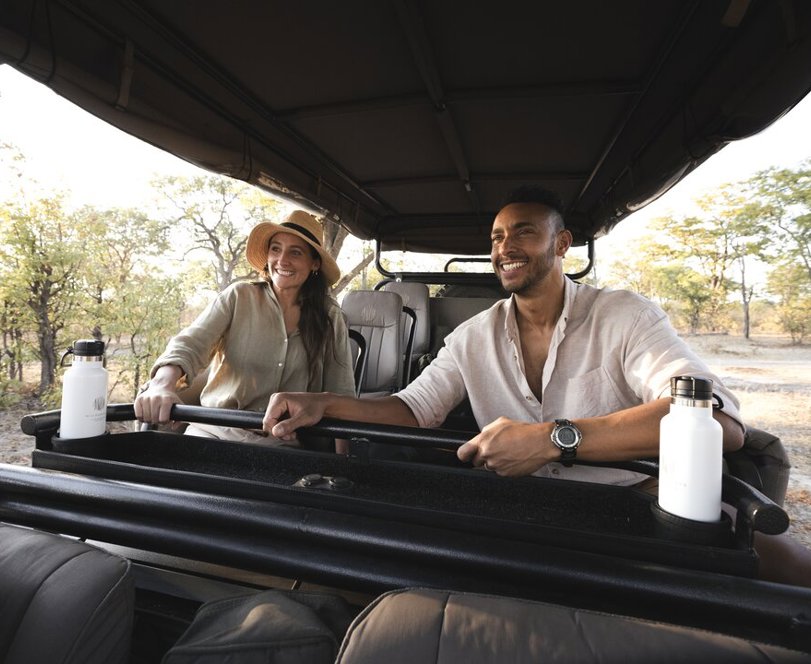 Couple on safari game drive Wilderness Kings Pool