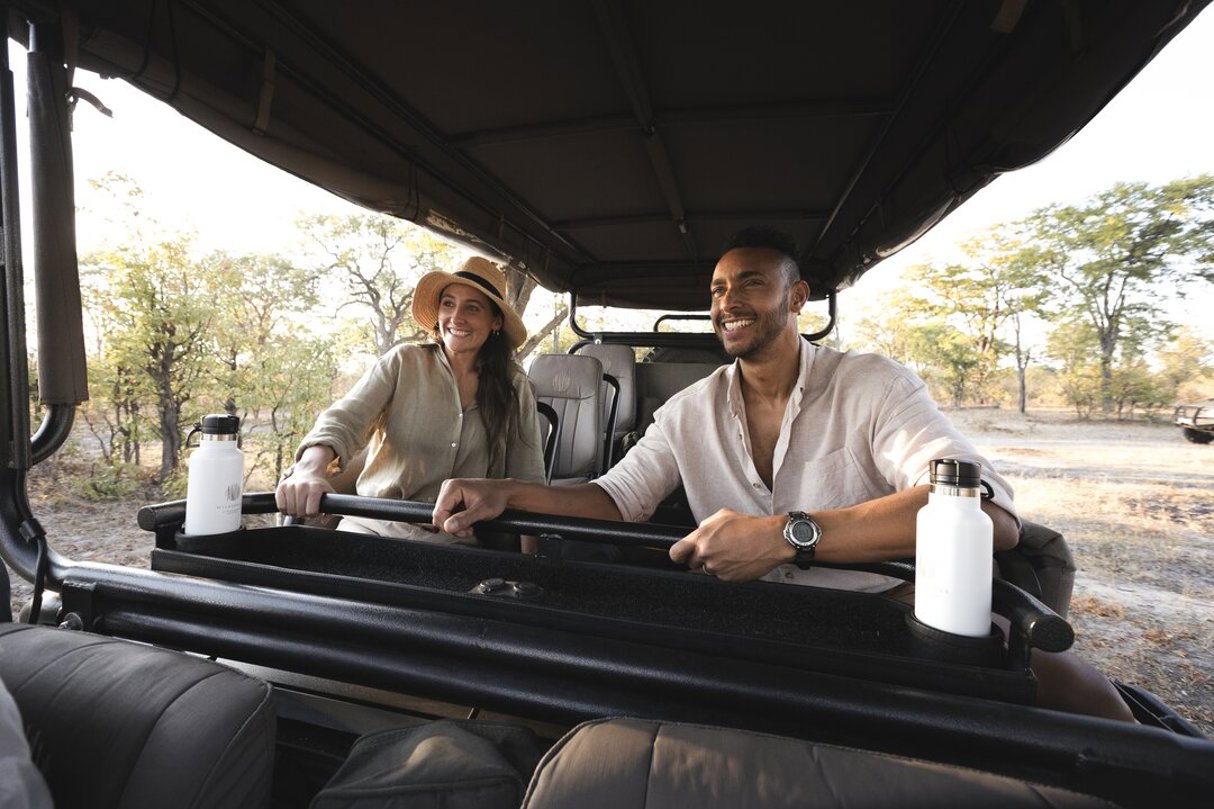 Couple on safari game drive Wilderness Kings Pool