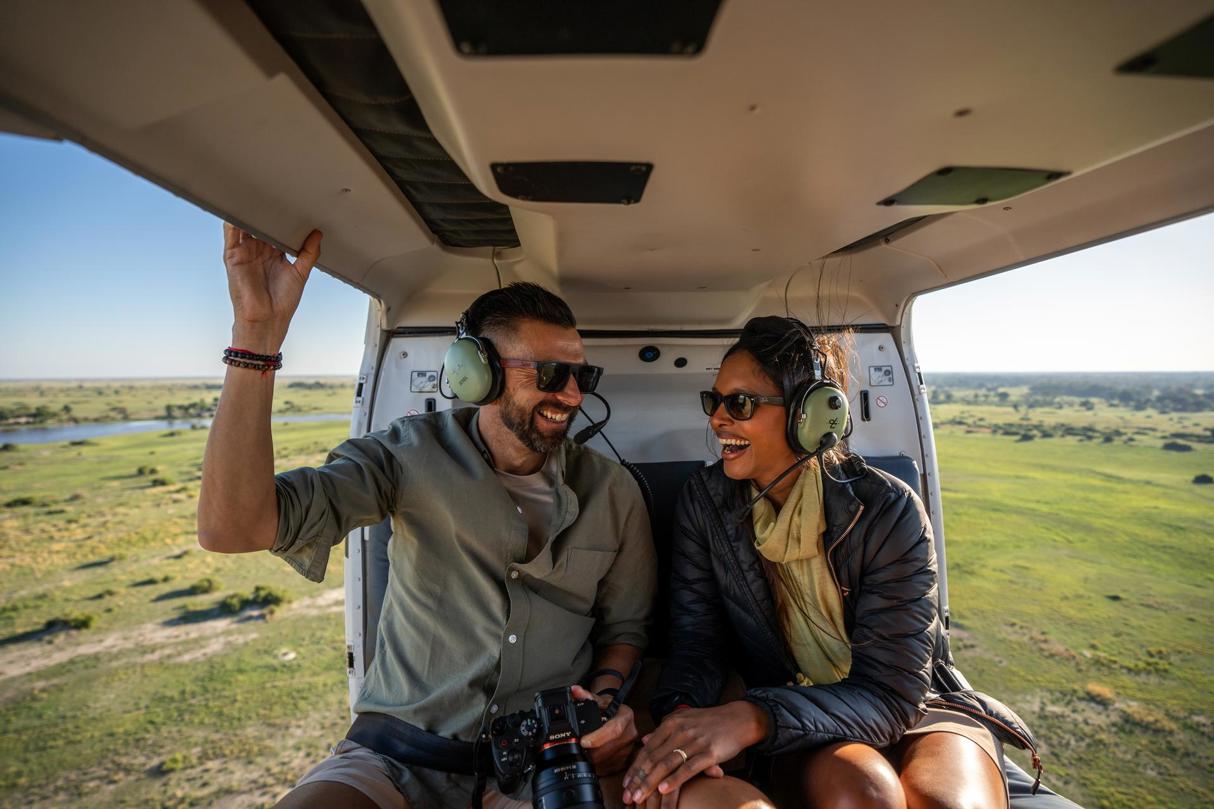 A couple enjoying a helicopter safari in Botswana