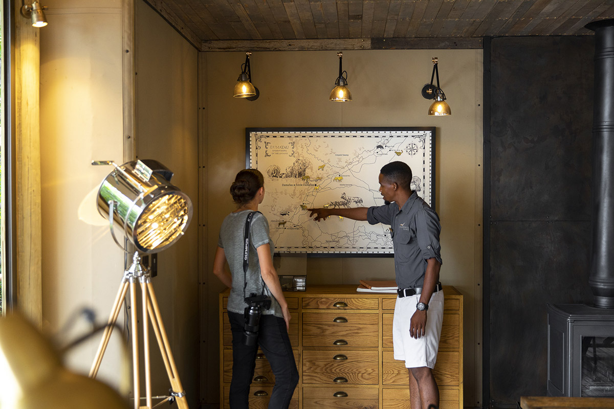 Sightings board and map of Wilderness DumaTau Linyanti