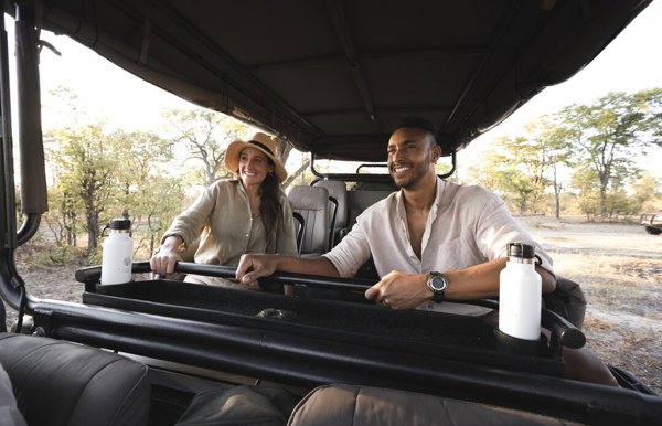 Couple enjoying game drive safari in Botswana with Wilderness