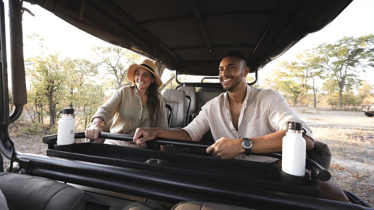 Couple enjoying game drive safari in Botswana with Wilderness