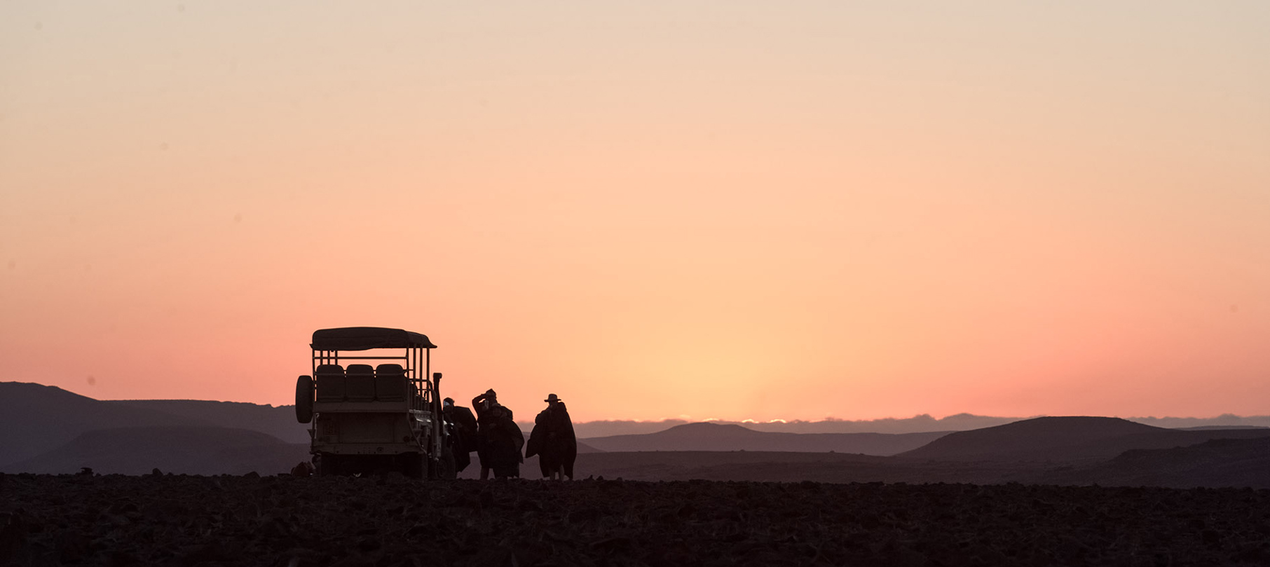 Guests enjoying a Namibian sunset in the remote Wilderness