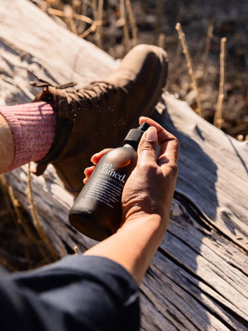 Guest applying untamed insect repellent