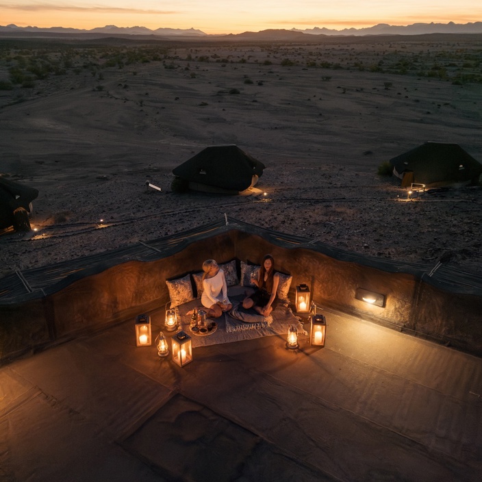 Guests at Doro Nawas enjoying dusk in camp