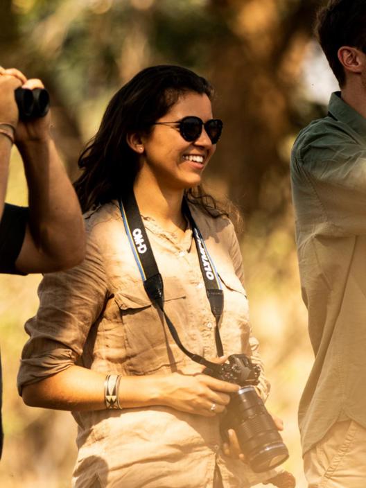 Safari guests spotting wildlife with binoculars