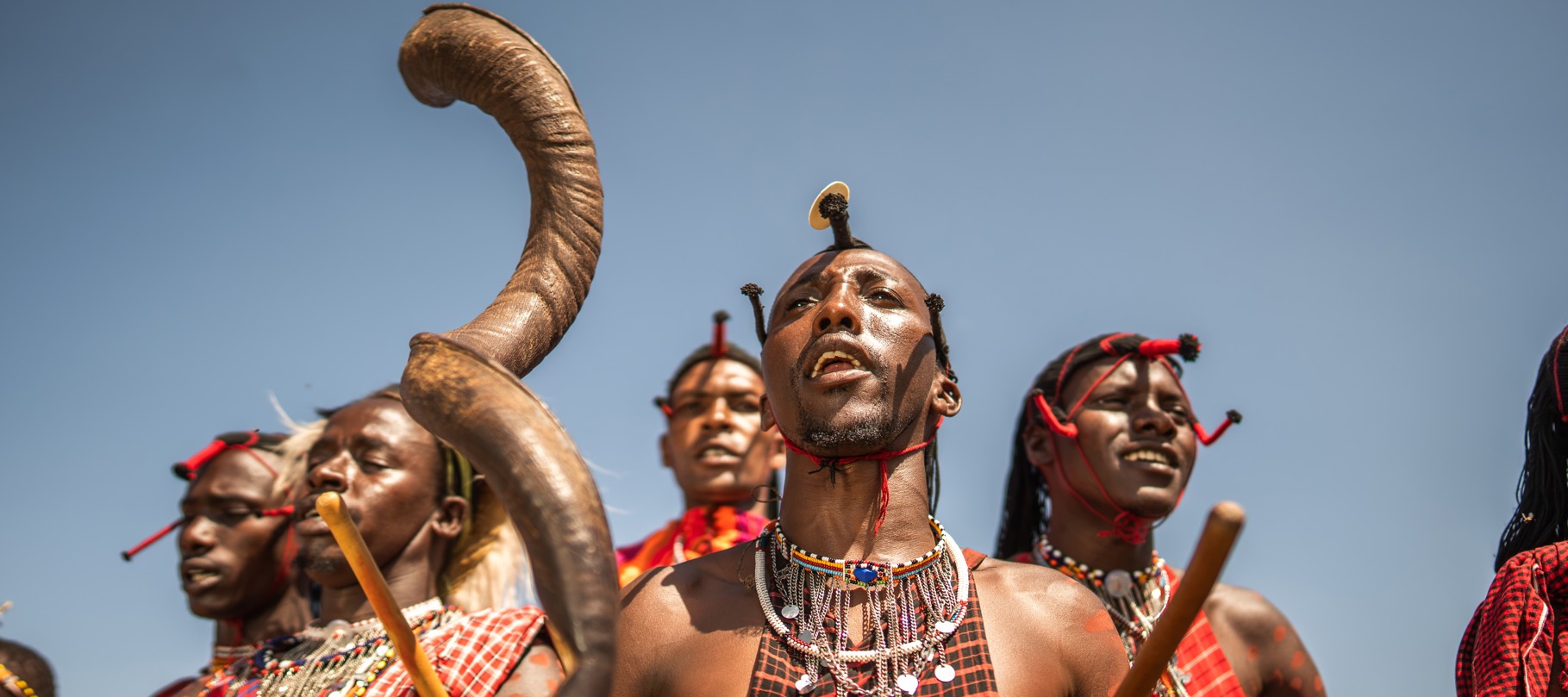 Maasai warriors performing a traditional dance at Wilderness Mara, Kenya