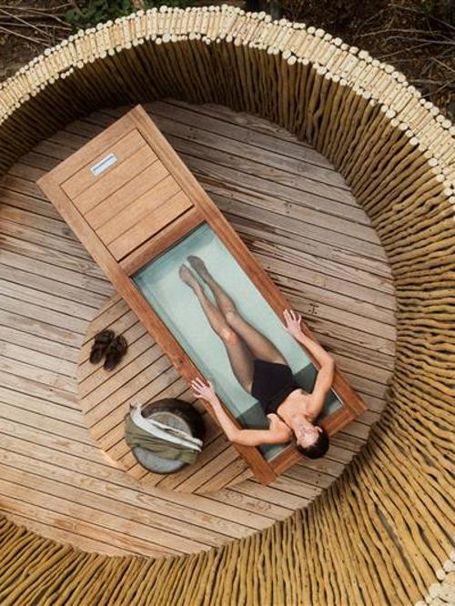 Woman in sauna and ice bath at Wilderness Mombo sanctuary