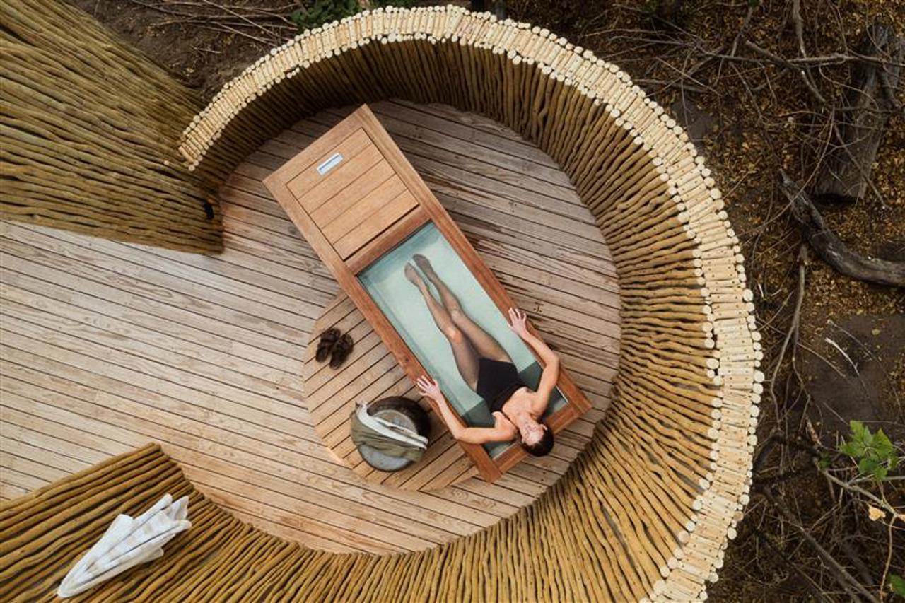 Woman in sauna and ice bath at Wilderness Mombo sanctuary