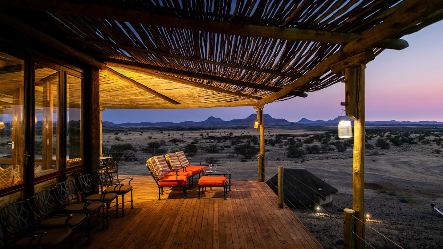 Wilderness Doro Nawas deck area overlooking the desert landscape at dusk