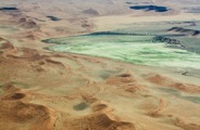 The Namibian desert transformed to green hues after rains in May 2026