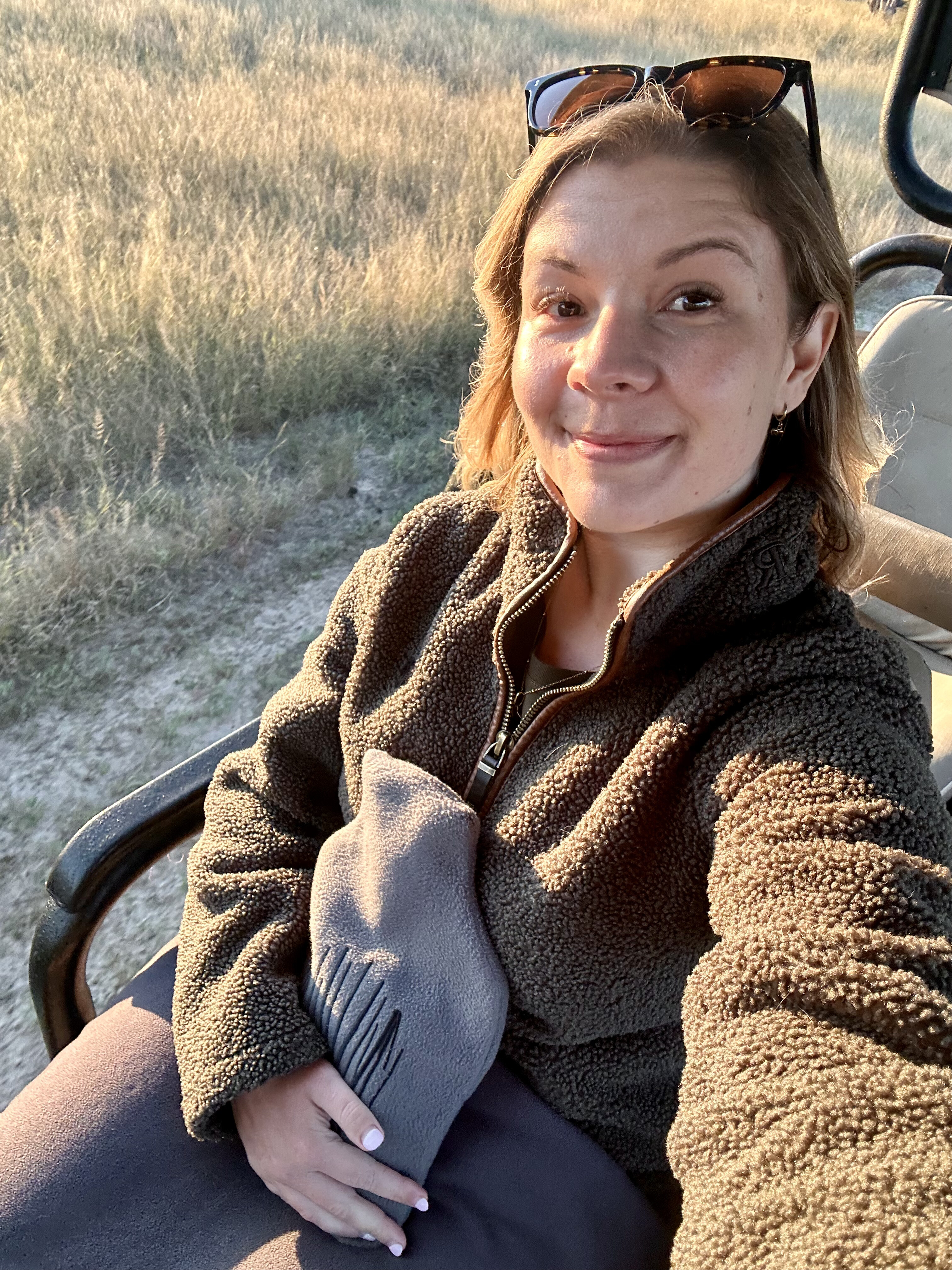 Kirsty Downing on a game drive vehicle enjoying the safari experience