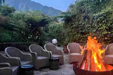 Firepit and mountain view at Wilderness Sabyinyo, Rwanda
