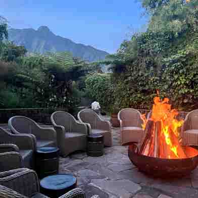 Firepit and mountain view at Wilderness Sabyinyo, Rwanda